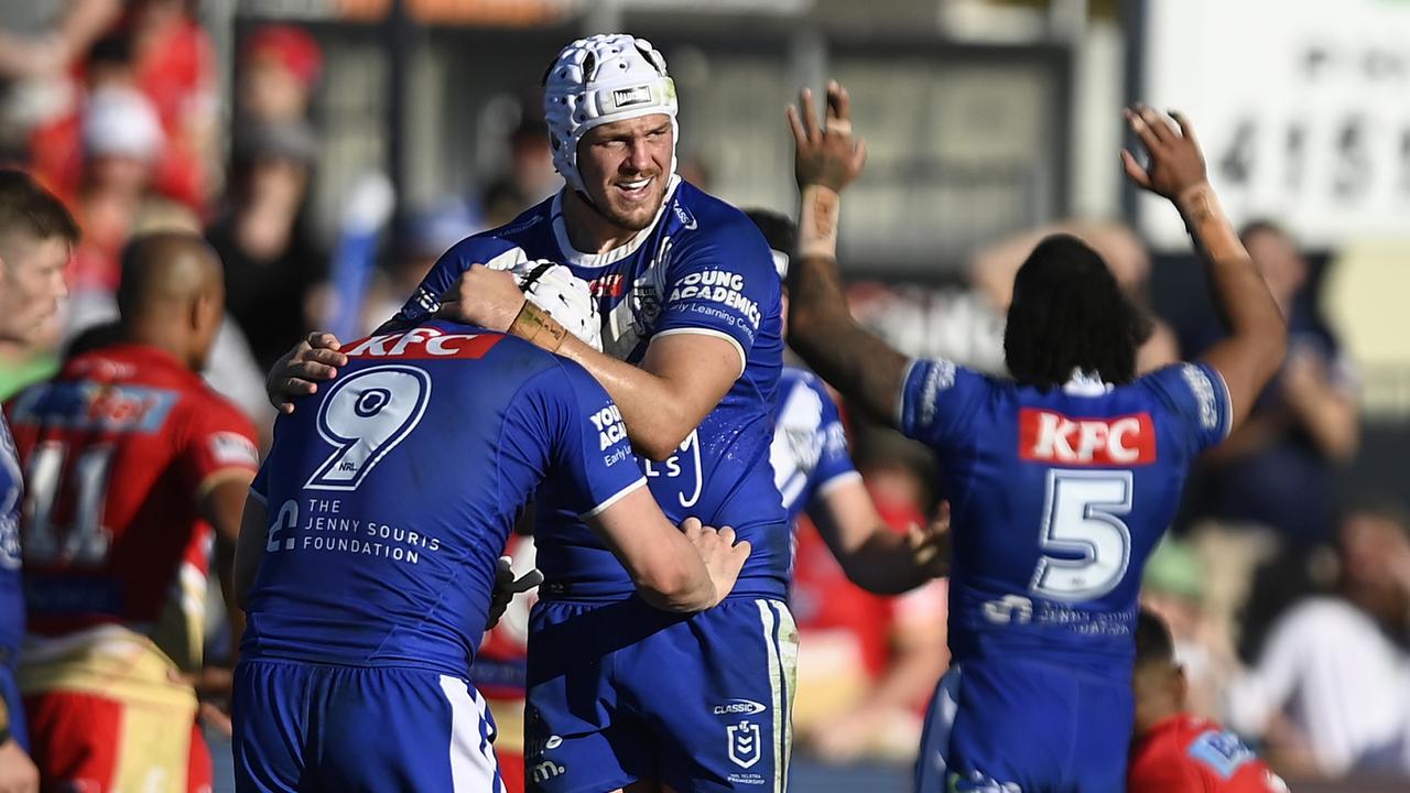 BUNDABERG, AUSTRALIA - JULY 30: The Bulldogs celebrate after winning the round 22 NRL match between Canterbury Bulldogs and Dolphins at Salter Oval on July 30, 2023 in Bundaberg, Australia. (Photo by Ian Hitchcock/Getty Images)