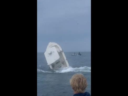 Shocking moment whale crashes into fishing boat