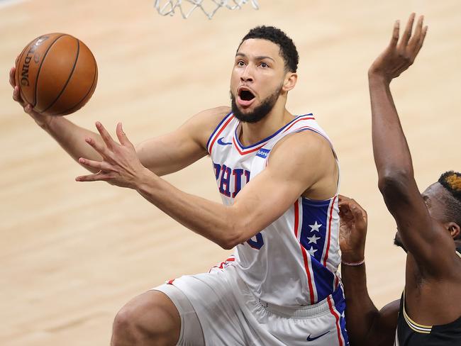 ATLANTA, GEORGIA - JUNE 14:  Ben Simmons #25 of the Philadelphia 76ers drives against Clint Capela #15 of the Atlanta Hawks during the first half of game 4 of the Eastern Conference Semifinals at State Farm Arena on June 14, 2021 in Atlanta, Georgia.  NOTE TO USER: User expressly acknowledges and agrees that, by downloading and or using this photograph, User is consenting to the terms and conditions of the Getty Images License Agreement. (Photo by Kevin C. Cox/Getty Images)