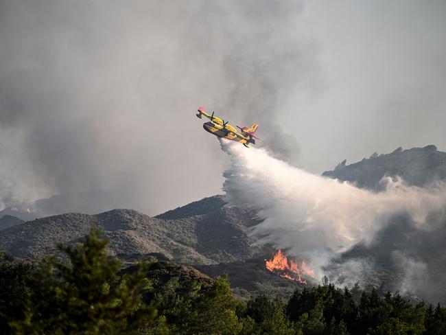 Several firefighting planes have been dispatched since fires began across the country on Sunday. Picture: AFP