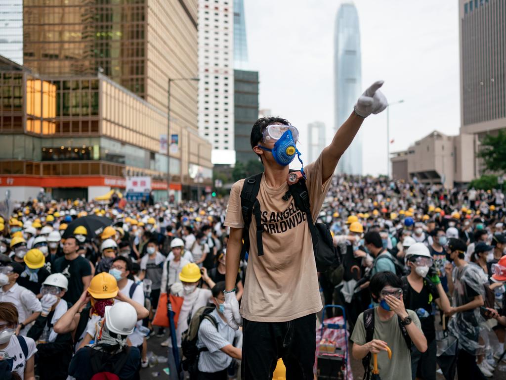 A protester stands with thousands of people. Picture: Anthony Kwan/Getty Images