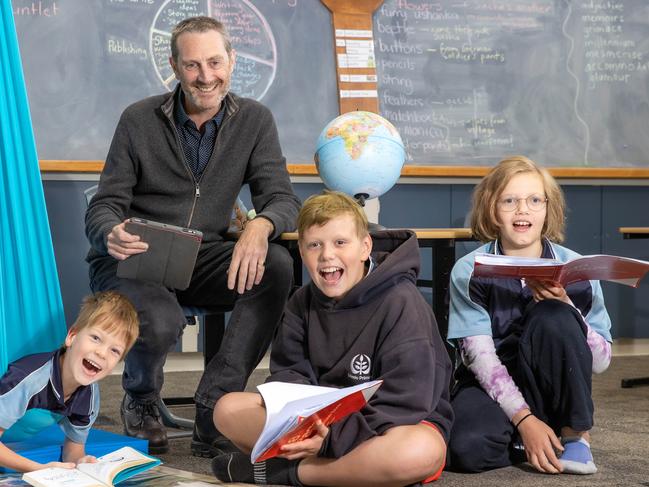 L-R Davyd 7, teacher Steven Mileham, Tyler 12Amelia 10.Because the School is small they can use aids like the swing that Davyd is in to help focus students.New data from School Hub about teacher student ratios for schools in Victoria. Olinda Primary School is a micro school with just 16 students and 3-4 teachers. Picture: Jason Edwards