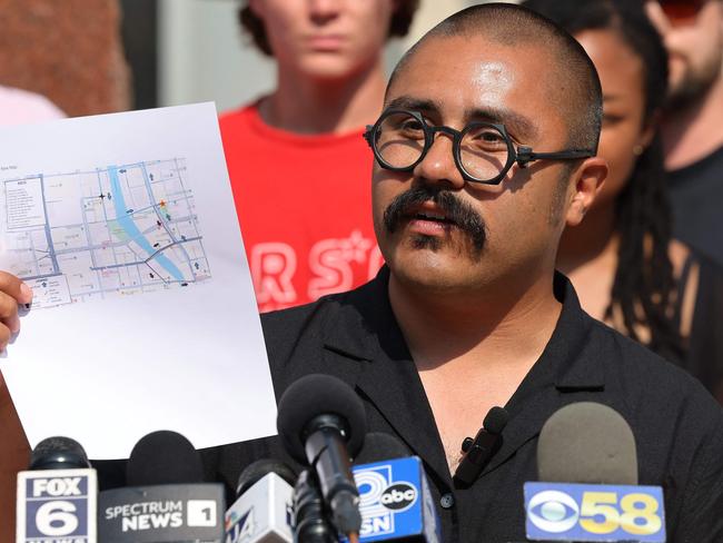 Omar Flores, co-chair of the Coalition to March on the RNC 2024, holds up a map of a planned protest march as he speaks during a press conference at Red Arrow Park on July 12, 2024 in Milwaukee, Wisconsin. Picture: Michael M. Santiago/Getty Images/AFP