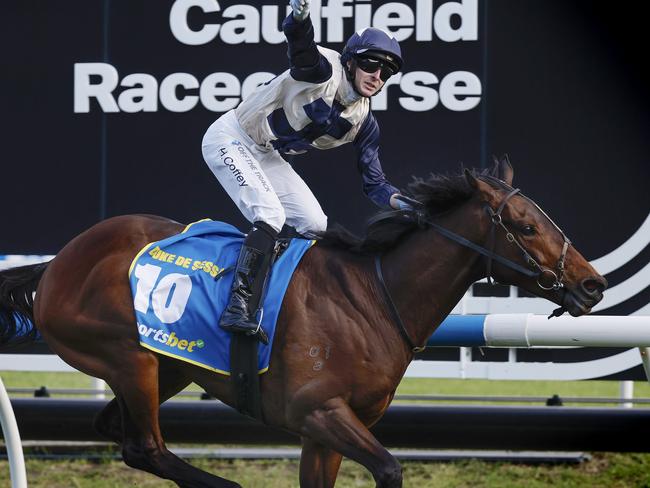 NCA. MELBOURNE, AUSTRALIA. October 19 , 2024. HORSE RACING. Caulfield Cup Day races at Caulfield Racecourse, Melbourne.   Race 8 The Caulfield Cup.  Jockey Harry Coffey stands up and celebrates after winning the Caulfield Cup on Duke De Sessa   .  Pic : Michael Klein