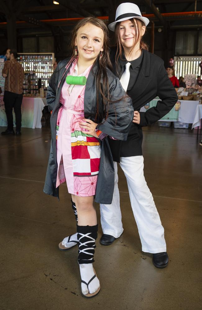 Demon Slayer characters Akasha George (left) as Nezuko and Ruby Cheers as Muzan at Comic-Geddon at The Goods Shed, Sunday, June 25, 2023. Picture: Kevin Farmer