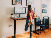 Simply substituting sitting for standing at work all day is not a perfect way to reverse negative health implications, new research says. Image: iStock