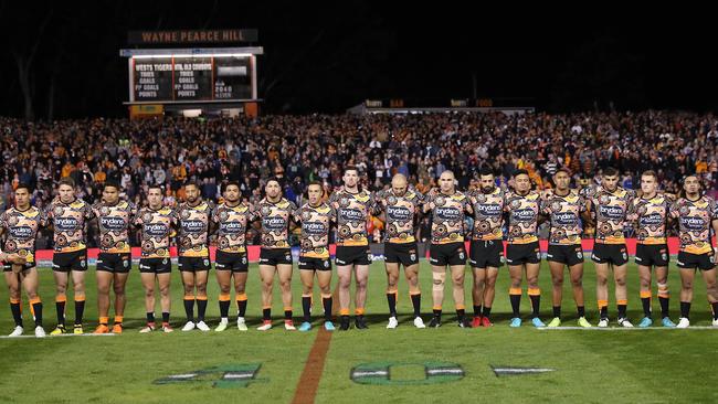 Wests Tigers players line up during the national anthem ahead of indigenous round at Leichhardt Oval. Picture: Phil Hillyard