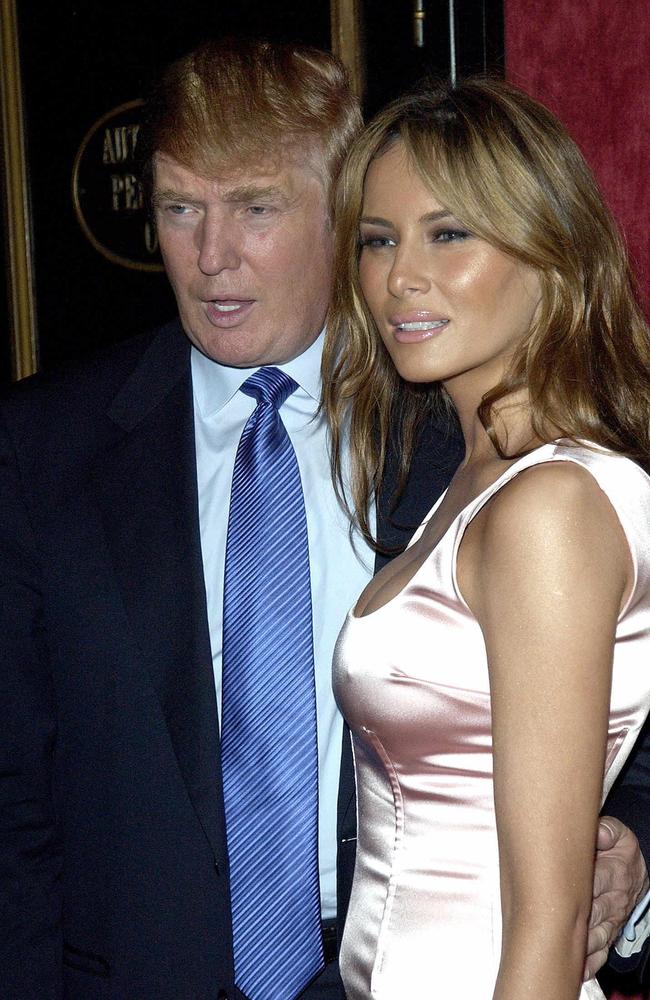 Donald and Melania Trump pose for photographers after arriving for the US premiere of the film War of the Worlds in New York on June 23, 2005.