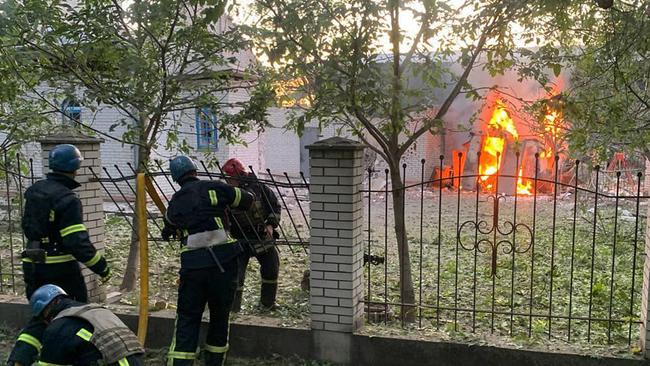 Ukrainian civil defence members battle a fire after Russian missiles struck Zaporizhzhia on Thursday. Picture: AFP