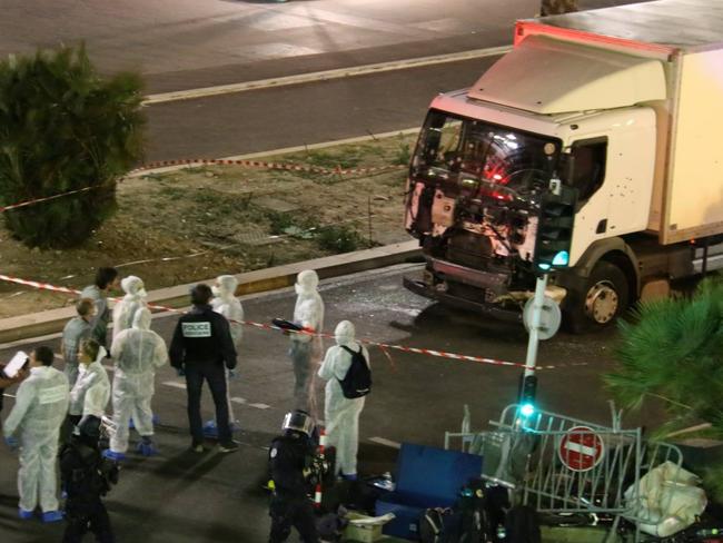 Forensic officers inspect the truck which was used to run people over as they watched the Bastille Day fireworks. Picture: Sasha Goldsmith