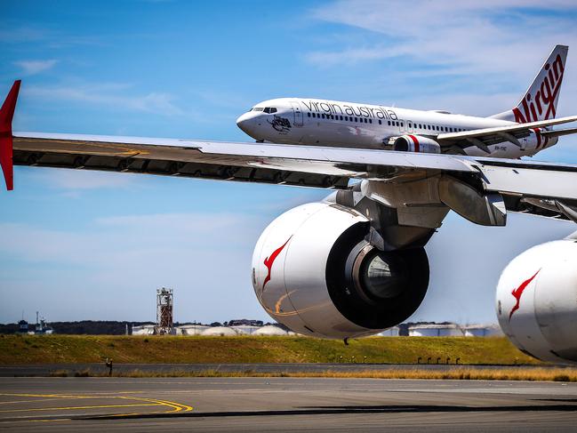 Qantas and Virgin Australia planes at Kingsford Smith International airport on November 15, 2019 in Sydney, Australia.