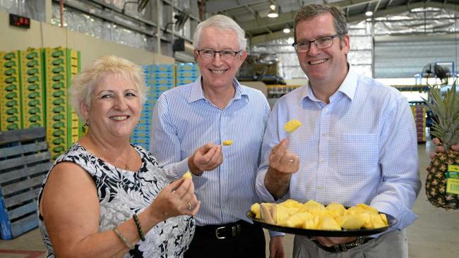 SWEET TASTE: Member for Capricornia Michelle Landry, Derek Lightfoot from Tropical Pineapples and Minister for Regional Development John McVeigh. Picture: Chris Ison ROK160318cpineapple1