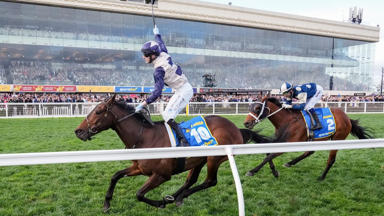 Harry Coffey salutes after winning the Caulfield Cup aboard Duke De Sessa. Picture: George Sal / Racing Photos