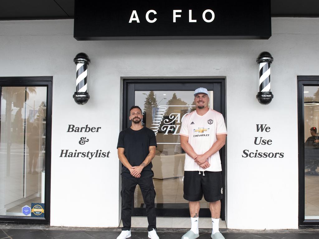 Roosters star Angus Crichton (right) alongside barber Florian Lagrange (left) outside their barber shop in Bondi. Picture: Jordi Kapiotas