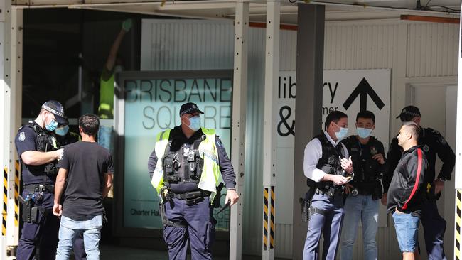 Police talking to pedestrians in the Brisbane CBD on Monday. Picture: Liam Kidston.