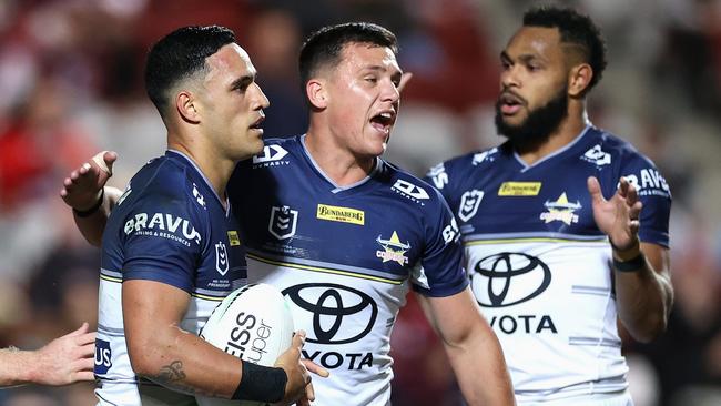 Valentine Holmes is congratulated by Scott Drinkwater after scoring for the Cowboys. Picture: Cameron Spencer/Getty Images