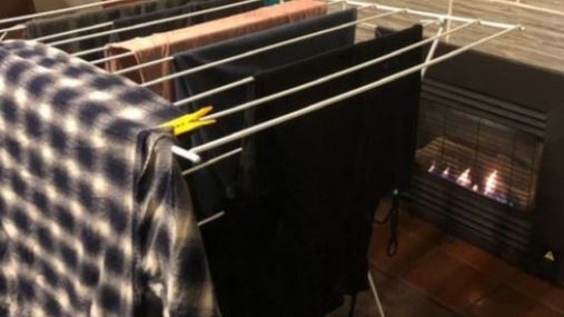 By hanging a large piece of clothing at the far end of the clothes rack, it traps in the heat and dries your clothes faster. Picture: Cleaning & Organising Inspiration Australia/Facebook