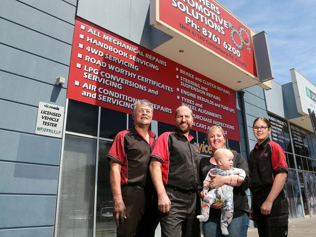 Stuart Kent, Craig Minca, Caroline Langan-Minca, holding son Jack and Janine Nudl at His 'n' Hers Automotive Solutions. Picture: Hamish Blair