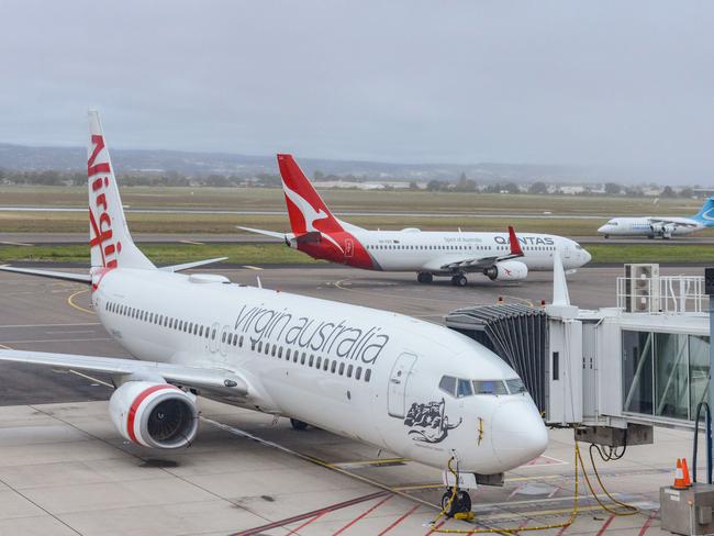 ADELAIDE, AUSTRALIA - NewsWire Photos SEPTEMBER 22, 2021: Virgin, Qantas and Cobham aircraft at Adelaide Airport. Picture: NCA NewsWire /Brenton Edwards