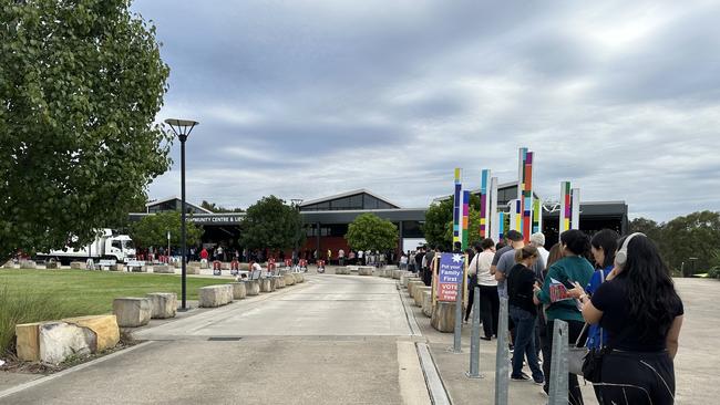 CARNES HILL, NSW - voters line up at the Carnes Hill community centre to cast their vote in the new electorate of Leppington. State election, March 2023.