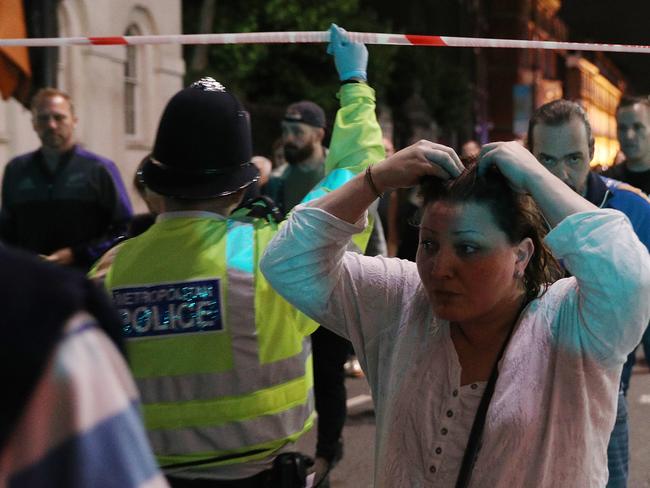 LONDON, ENGLAND - JUNE 03: Members of the public are led away from the scene near London Bridge after a suspected terrorist attack on June 4, 2017 in London, England. Police responded to what they are calling terrorist attacks on London Bridge and Borough Market where at least 20 people were injured and one person was killed. (Photo by Dan Kitwood/Getty Images)