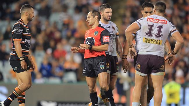 Referee Ashley Klein tries to explain his decision. (Mark Evans/Getty Images)