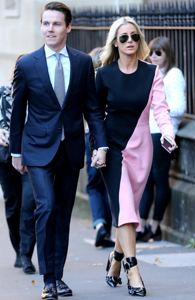 Oliver Curtis and wife Roxy Jacenko hold hands as they arrive at court today. Picture: Ross Schultz