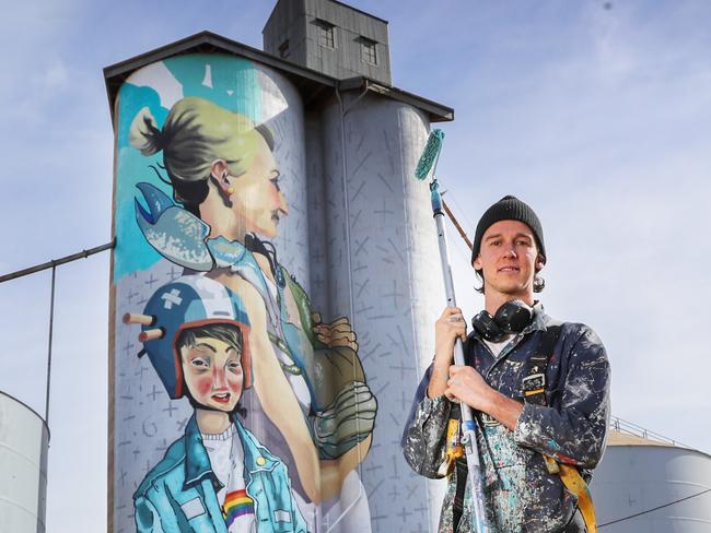 HOLD FOR THE HERALD SUN PIC DESK-----Artists Kitt Bennett working on this old grain silo in Albacutya, in north western Victoria. Picture: Alex Coppel.