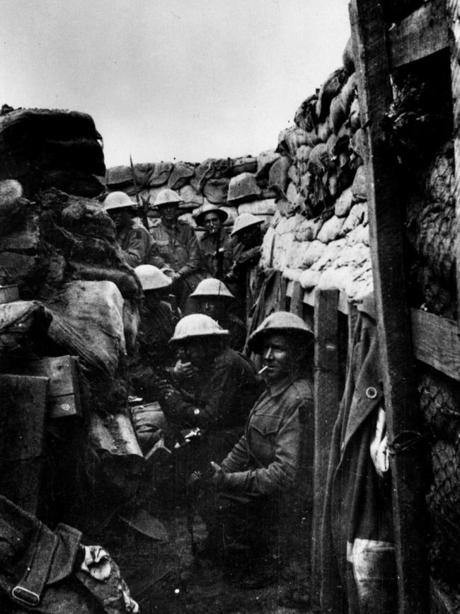 Western Front AIF soldiers from the 53rd Battalion shelter in a trench waiting for the attack at Fromelles in France. Picture: Australian War Memorial.