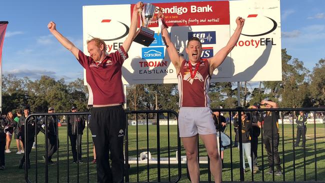 Mav Gleed holds the 2018 Division 4 cup aloft with then-coach Jamie Carpenter.