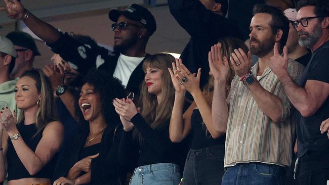 Taylor Swift surrounded by fellow stars including Blake Lively, Ryan Reynolds and Hugh Jackman. (Photo by Elsa/Getty Images)