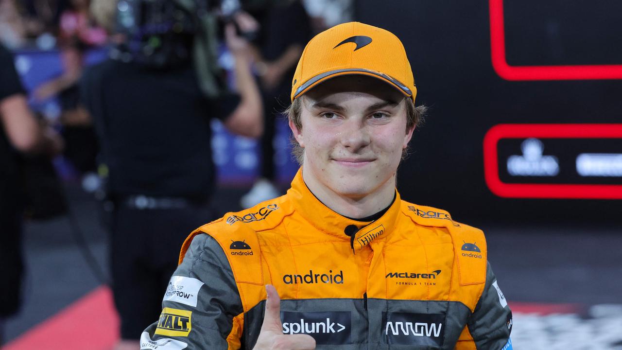 Oscar Piastri celebrates after finishing third in qualifying for the Abu Dhabi Grand Prix. (Photo by Giuseppe CACACE / AFP)