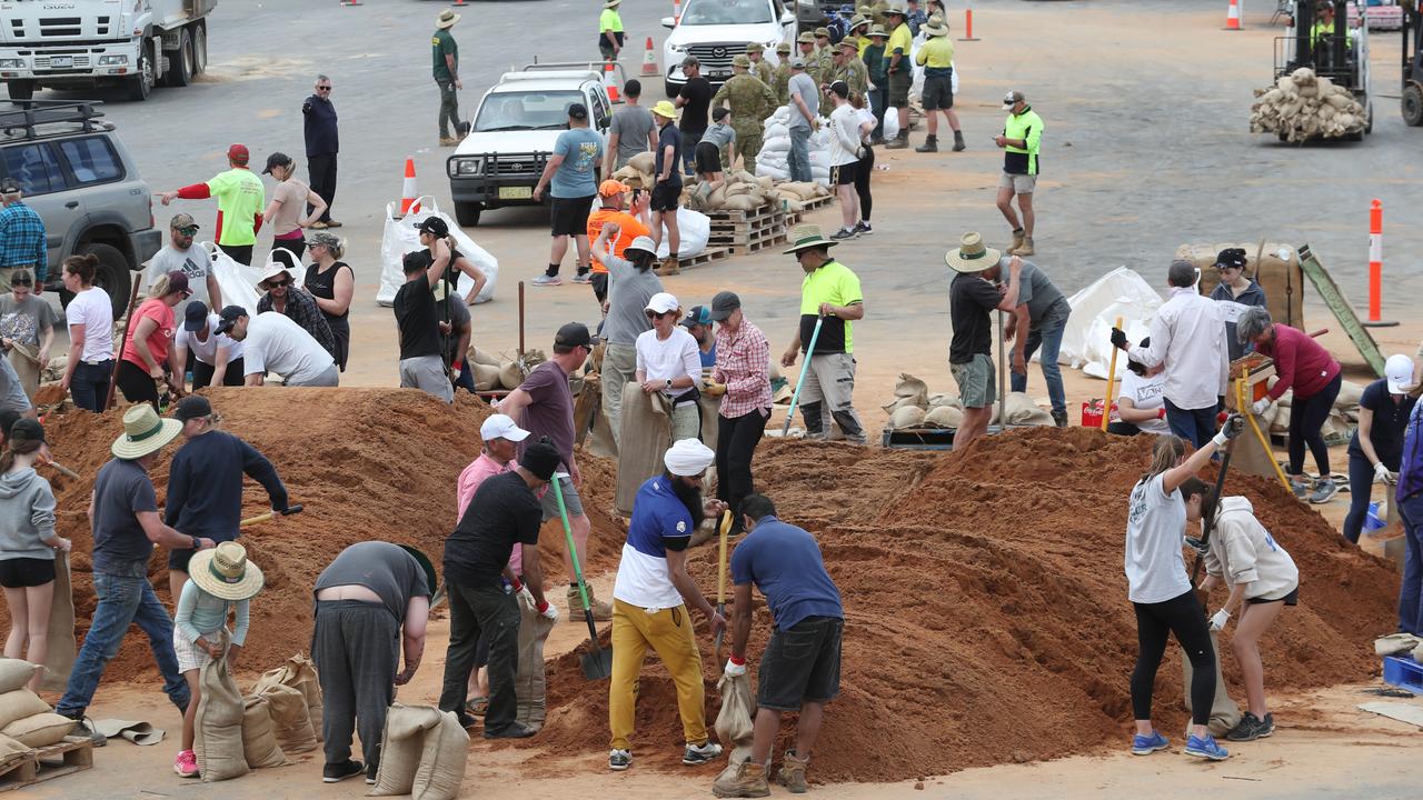 Volunteers sandbag. Picture: David Crosling,