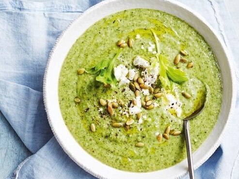 Healthy broccoli, zucchini and leek soup with feta and seeds.