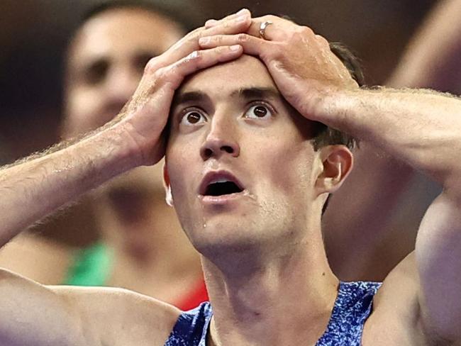 US' Kenneth Rooks reacts after placing second in the men's 3000m steeplechase final of the athletics event at the Paris 2024 Olympic Games at Stade de France in Saint-Denis, north of Paris, on August 7, 2024. (Photo by Anne-Christine POUJOULAT / AFP)