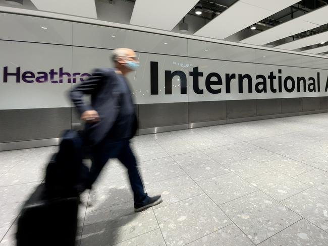 International passengers walk through the arrivals area at Terminal 5 at Heathrow Airport. Picture: Leon Neal/Getty Images