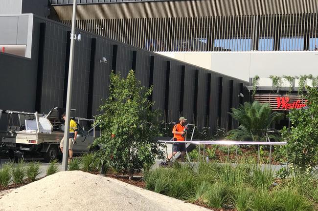 Workers putting the finishing touches on the Westfield Coomera at Coomera Town Centre