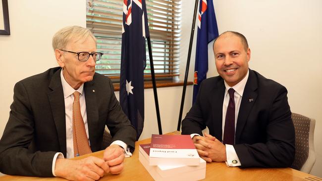 Commissioner Kenneth Hayne and Treasurer Josh Frydenberg (right) are seen with the final report from the Royal Commission into Misconduct in the Banking, Superannuation and Financial Services Industry, at Parliament House in Canberra, Friday, February 1, 2019. (AAP Image/Fairfax Media Pool, Kym Smith)