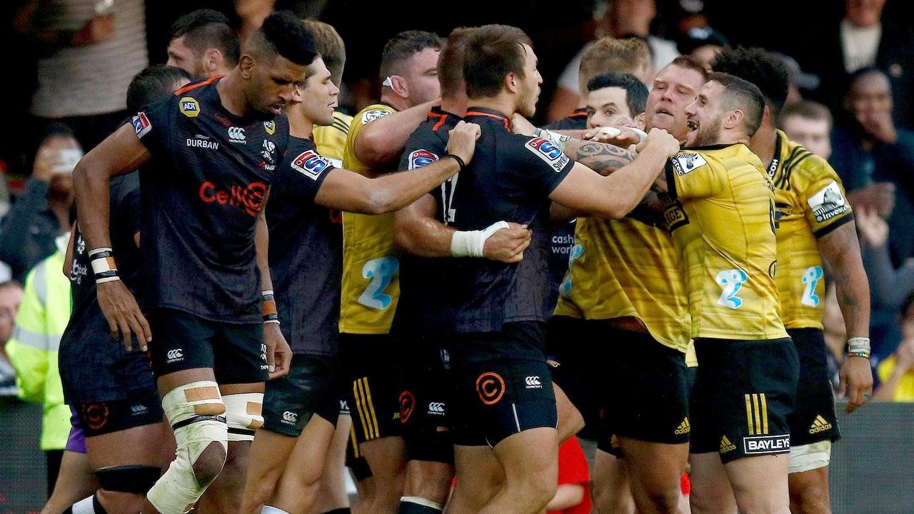 Sharks players fight with Hurricanes players at the Kings Park Rugby Stadium.