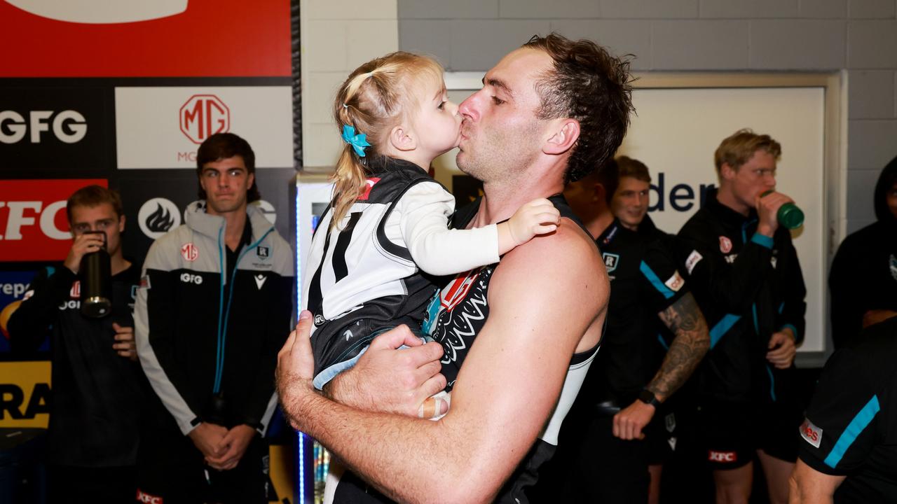 Finlayson with Sophia after the win. Picture: James Elsby/AFL Photos