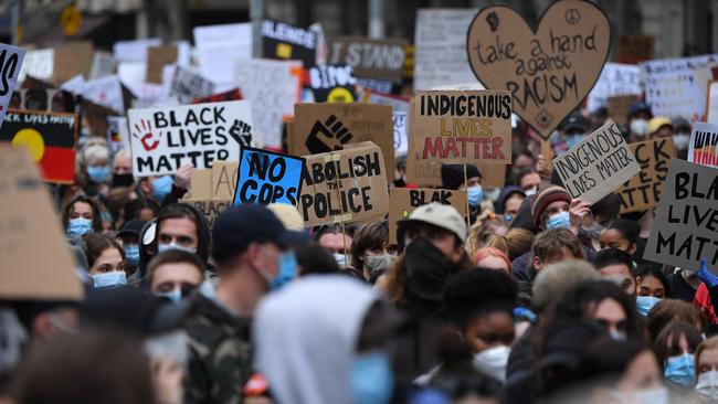 Marchers packed tightly together walk toward Bourke and Swanston streets. Picture: Getty Images