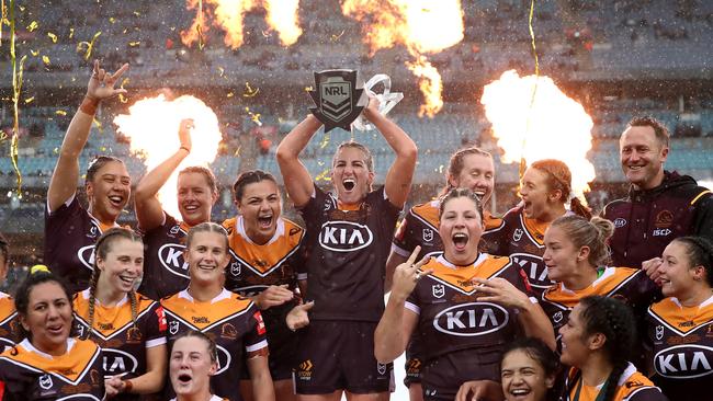 Broncos star Ali Brigginshaw holds aloft the premiership trophy after winning the 2020 NRLW grand final.