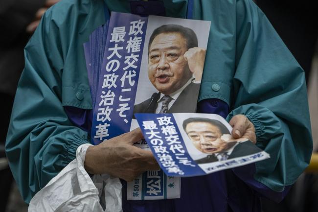 Japan's Prime Minister Shigeru Ishiba (C) arrives for a campaign speech in support of his Liberal Democratic Party in Tokyo