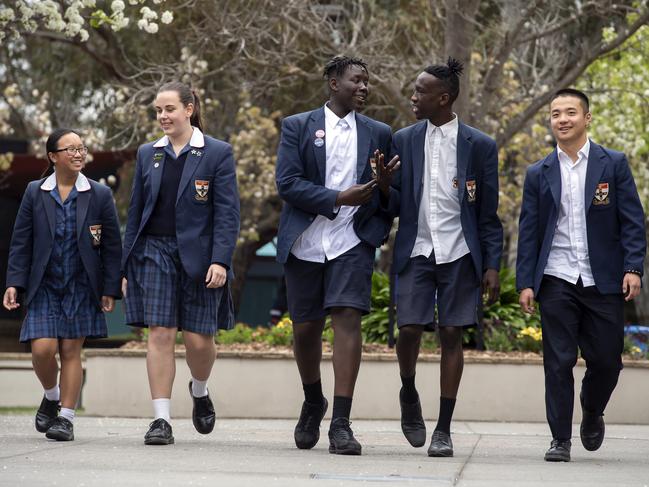 St Francis Xavier College has more than 3000 students in a diverse, growing area. Pictured are students Cassandra, Harper, Justin, Mawien and Edward. Picture: Andy Brownbill