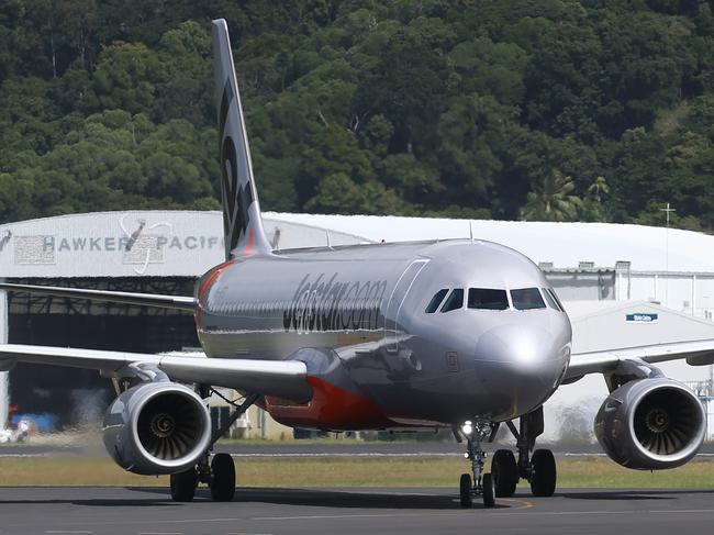 A Jetstar Airbus A320 passenger jet plane touches down at the Cairns Airport. PICTURE: BRENDAN RADKE