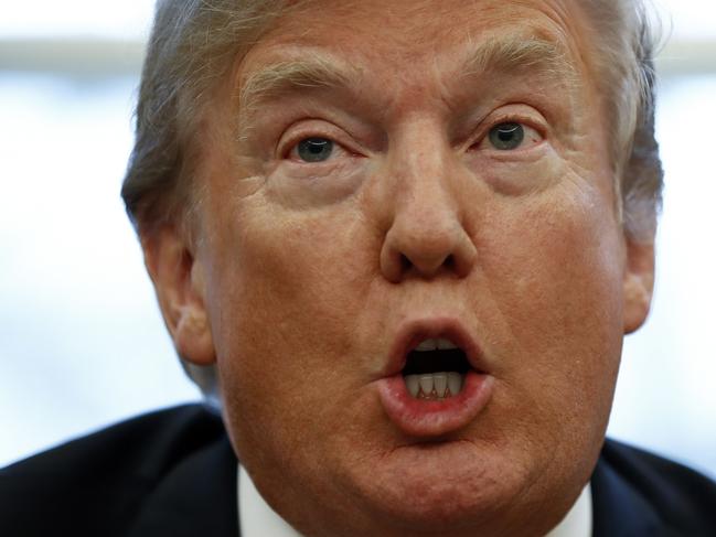 President Donald Trump speaks to media as he signs Section 201 actions in the Oval Office of the White House in Washington, Tuesday, Jan. 23, 2018. (AP Photo/Carolyn Kaster)