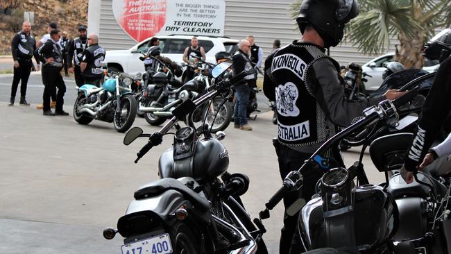 Members of the Mongols outlaw motorcycle club fuel up in Alice Springs before being stopped by police on the Stuart Hwy on a run to Darwin on October 12, 2022. Picture: Jason Walls