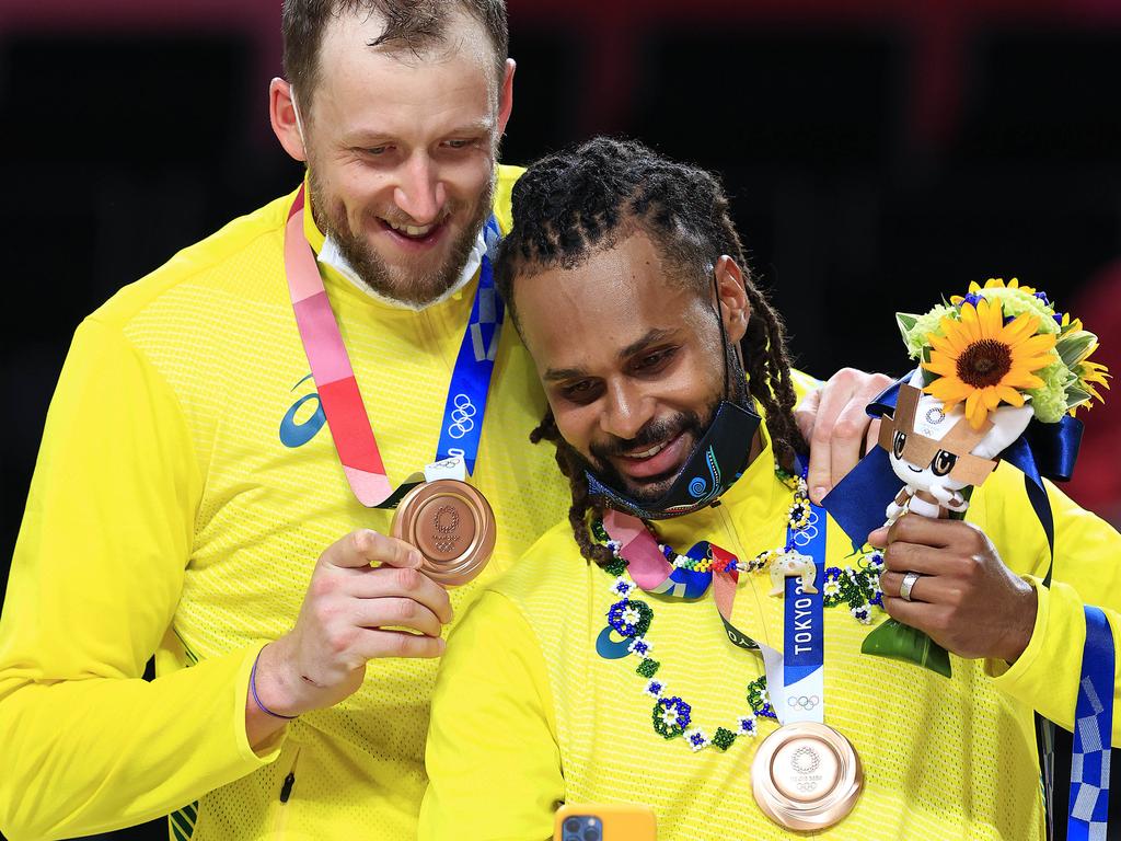 Joe Ingles and Patty Mills show off their Olympic bronze medals in Tokyo, after making history with the Australian Boomers. Rose Gold Vibes Only. Picture: Adam Head