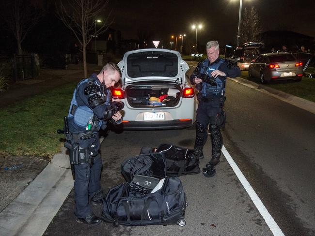 Police were forced to wear riot gear for protection. Picture: Jason Edwards