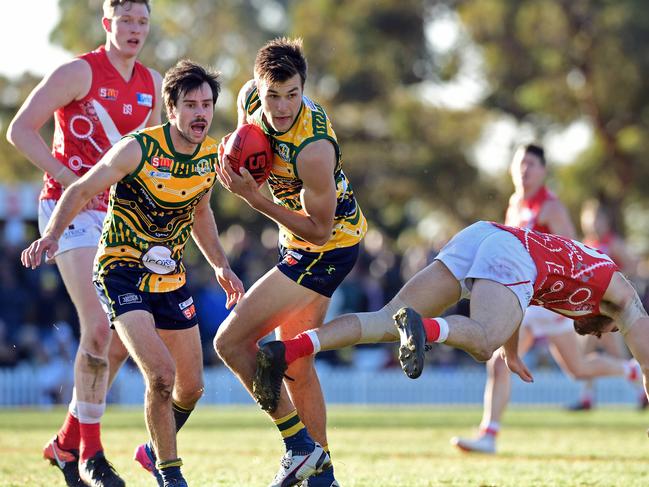 Eagles player Joe Heinjus gathers the ball. Picture: Tom Huntley.